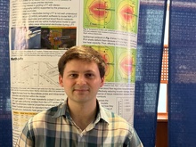 Daniel Keefe poses in front of his poster