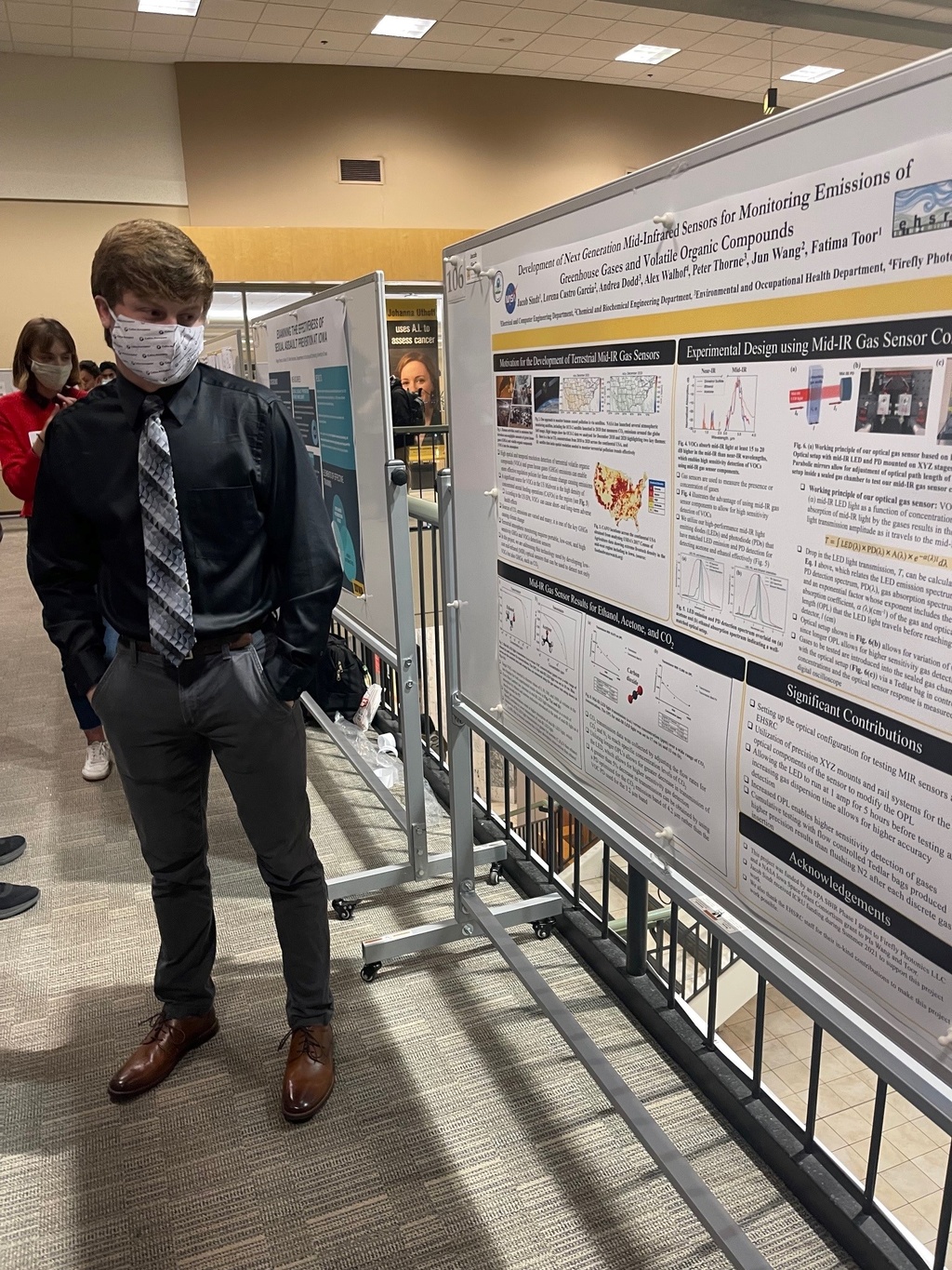 Photo of Jacob Sindt and his poster at the Undergraduate Research Festival